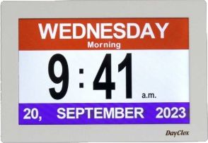 A DayClox digital day clock with large day, time, and date text